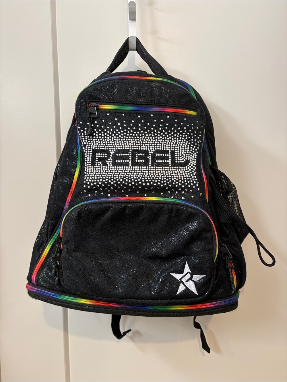 Rebel Black Backpack with Rainbow Trim and Rhinestone Logo Panel